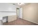 Bedroom featuring wood floors, a ceiling fan and a built-in desk area at 18525 N 85Th N Ave, Peoria, AZ 85382