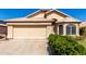 Charming single-story home with a two-car garage, desert landscaping, and a tile roof at 18525 N 85Th N Ave, Peoria, AZ 85382