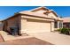 Charming single-story home with a two-car garage, desert landscaping, and a tile roof at 18525 N 85Th N Ave, Peoria, AZ 85382
