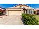 Charming single-story home with a two-car garage, desert landscaping, and a tile roof at 18525 N 85Th N Ave, Peoria, AZ 85382