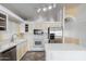 Kitchen features white cabinets, stainless steel appliances, and a tile backsplash at 18525 N 85Th N Ave, Peoria, AZ 85382