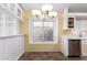 Eat-in kitchen with stainless steel dishwasher and chandelier at 18525 N 85Th N Ave, Peoria, AZ 85382