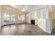 Bright living room with tile floors, fireplace, built-in shelving, and French doors to outdoor space at 18525 N 85Th N Ave, Peoria, AZ 85382