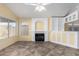 Living room features fireplace, tile flooring, and natural light at 18525 N 85Th N Ave, Peoria, AZ 85382
