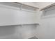 Walk-in closet with plenty of hanging storage and built-in shelving at 18525 N 85Th N Ave, Peoria, AZ 85382