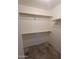 Walk-in closet with built-in shelving and hanging rods for maximum storage at 18525 N 85Th N Ave, Peoria, AZ 85382