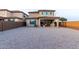 A large, neutral gravel backyard is perfect for outdoor entertaining and relaxation at 19703 W Badgett Ln, Litchfield Park, AZ 85340