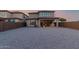 Large backyard perfect for relaxing with a covered patio and low-maintenance desert landscaping at 19703 W Badgett Ln, Litchfield Park, AZ 85340