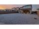 Large backyard perfect for relaxing with a covered patio and low-maintenance desert landscaping at 19703 W Badgett Ln, Litchfield Park, AZ 85340