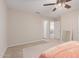 A bright bedroom featuring neutral walls and carpet with openings to other rooms at 19703 W Badgett Ln, Litchfield Park, AZ 85340
