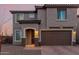 Charming two-story home with a two-car garage and covered entryway at 19703 W Badgett Ln, Litchfield Park, AZ 85340
