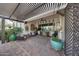 Charming outdoor patio with comfortable seating, a ceiling fan, and unique decor at 20766 W White Rock Rd, Buckeye, AZ 85396