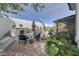Inviting backyard patio with stylish outdoor furniture and fireplace, perfect for entertaining at 20766 W White Rock Rd, Buckeye, AZ 85396