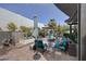 Outdoor seating area with an umbrella, landscaping, and a pergola at 20766 W White Rock Rd, Buckeye, AZ 85396