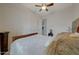 Comfortable bedroom with dark wood furniture, plush bedding, and soft, patterned carpet at 20766 W White Rock Rd, Buckeye, AZ 85396