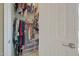 Walk-in closet with ample storage space, organized with racks and plastic bins at 20766 W White Rock Rd, Buckeye, AZ 85396