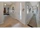 Bright foyer with tile floors, featuring white doors and archway to the living room at 20766 W White Rock Rd, Buckeye, AZ 85396