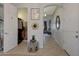 Hallway featuring tiled flooring, neutral wall paint, and decorative items at 20766 W White Rock Rd, Buckeye, AZ 85396
