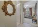 Hallway that leads to the living room, with a decorative mirror hanging on the wall at 20766 W White Rock Rd, Buckeye, AZ 85396