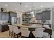 Spacious kitchen island with seating, granite countertops and modern appliances at 20766 W White Rock Rd, Buckeye, AZ 85396
