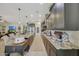 Bright kitchen features stainless steel appliances, generous countertops, and an open view to living room at 20766 W White Rock Rd, Buckeye, AZ 85396