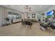 Bright living room features tile flooring, a ceiling fan, and stylish decor at 20766 W White Rock Rd, Buckeye, AZ 85396