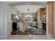 Elegant living room featuring comfortable seating, a custom mural, and a stylish chandelier at 20766 W White Rock Rd, Buckeye, AZ 85396