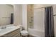 A well maintained bathroom with a tub and shower combination, vanity and sink at 2113 N 210Th Ave, Buckeye, AZ 85396