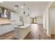 A modern kitchen featuring a large island with a white countertop and stainless steel appliances at 2113 N 210Th Ave, Buckeye, AZ 85396