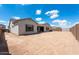 Expansive backyard with dirt landscape, offering a blank canvas for creating your dream outdoor oasis at 26161 S 225Th Way, Queen Creek, AZ 85142