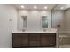 Bright bathroom with dual sinks, and modern shower at 26161 S 225Th Way, Queen Creek, AZ 85142