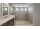 Bathroom featuring a spacious walk-in shower with multiple shower heads and a modern vanity at 26161 S 225Th Way, Queen Creek, AZ 85142