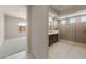 Bathroom featuring a glass-enclosed shower with multiple shower heads and dual sinks at 26161 S 225Th Way, Queen Creek, AZ 85142