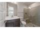 Contemporary bathroom featuring sleek vanity, modern fixtures, glass shower with a seat, and stylish design elements at 26161 S 225Th Way, Queen Creek, AZ 85142