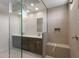 Spacious bathroom with a glass-enclosed shower, dual sinks, and modern fixtures at 26161 S 225Th Way, Queen Creek, AZ 85142