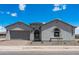 Charming single-story home featuring a tile roof, stucco exterior, and a well-manicured front yard at 26161 S 225Th Way, Queen Creek, AZ 85142