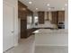 Stylish kitchen featuring dark wood cabinetry, stainless steel appliances, and granite countertops at 26161 S 225Th Way, Queen Creek, AZ 85142