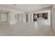 Open-concept living area showcasing tiled floors and seamless transition to the kitchen space at 26161 S 225Th Way, Queen Creek, AZ 85142