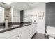 Contemporary bathroom with double sinks, granite counters and a tile shower at 2630 W Javelina Ave, Mesa, AZ 85202