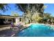 Backyard pool with lounge chairs and lush landscaping at 2630 W Javelina Ave, Mesa, AZ 85202