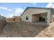Spacious backyard featuring block fencing and a covered patio, offering privacy and shade at 2681 N Riverside Dr, Florence, AZ 85132