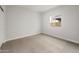 Cozy, carpeted bedroom with natural light at 2681 N Riverside Dr, Florence, AZ 85132