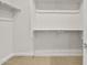 Walk-in closet featuring shelving and ample storage space at 2681 N Riverside Dr, Florence, AZ 85132