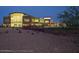 A scenic view of the lit Community Center at dusk at 2681 N Riverside Dr, Florence, AZ 85132
