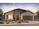 Charming single-story home with a desert landscape and two car garage at 2681 N Riverside Dr, Florence, AZ 85132