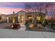 Charming desert home with a two-car garage and a tiled roof and entryway at 26853 W Marco Polo Rd, Buckeye, AZ 85396