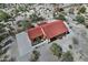 Stunning aerial view of a desert home featuring a red roof, concrete driveway, and natural desert landscaping at 30066 N Holly Dr, San Tan Valley, AZ 85144