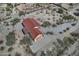 Beautiful home with a red roof in a desert landscape, featuring a long driveway and natural desert landscaping at 30066 N Holly Dr, San Tan Valley, AZ 85144