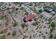 Beautiful home with a red roof and a desert landscape; the surrounding area features natural desert plants and a dirt road at 30066 N Holly Dr, San Tan Valley, AZ 85144