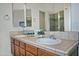 Bathroom with double sink vanity and a glass enclosed shower at 30066 N Holly Dr, San Tan Valley, AZ 85144